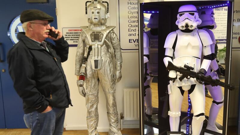 A member of the public views items seized from a drugs lord which are to be auctioned at Wilsons Auctions in Mallusk, Co Antrim. Photograph: Niall Carson/PA Wire
