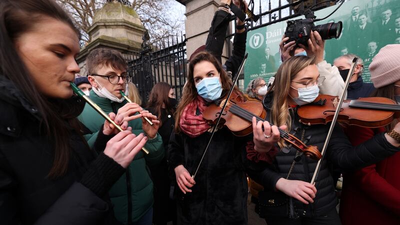 Musicians and friends of Ashling Murphy play at a vigil for the teacher  outside Leinster House. Photograph: Laura Hutton/The Irish Times