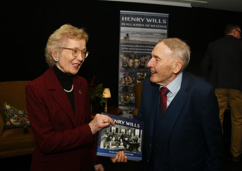 Photographer Henry Will's with former President Mary Robinson during the launch of his book In All Kinds of Weather. Photograph: John O'Grady