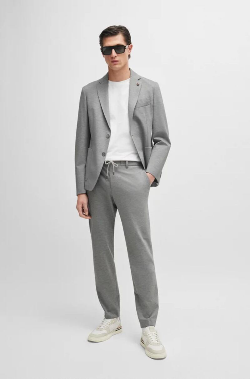 Grey slim fit jacket in grey melange, €549, and trousers, €319, from Boss on Grafton Street, Tony McDonnell Dundalk and  Brown Thomas