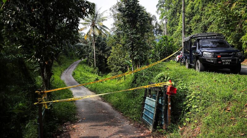 Police lines are seen on the entrance of a road as the search-and-rescue operation for 15-year-old Nóra Quoirin from London is continued, in Seremban, Negeri Sembilan, Malaysia. Photograph: Fazry Ismail/Reuters