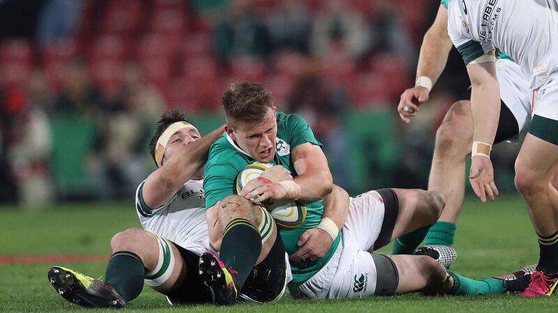 Ireland’s Craig Gilroy is tackled by  Francois Louw. Photo: Billy Stickland/Inpho
