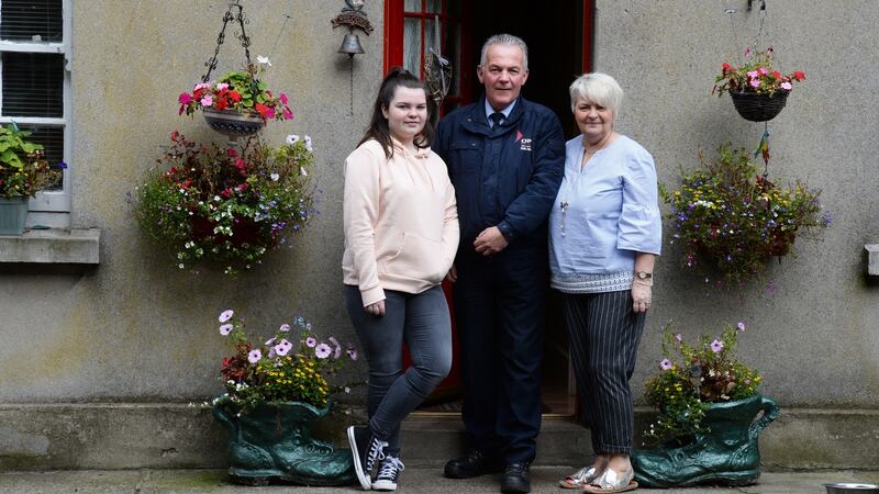 Paddy Crowe with his wife Phyllis and daughter Alanah at their home, the Gate Lodge at Dublin Zoo. Photograph: Cyril Byrne/The Irish Times