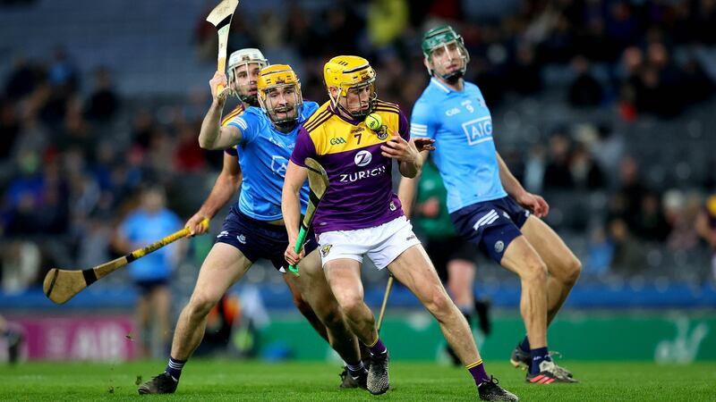 Wexford’s Damien Reck is challenged by Dublin’s Ronan Hayes during the Walsh Cup final at Croke Park. Photograph: Ryan Byrne/Inpho
