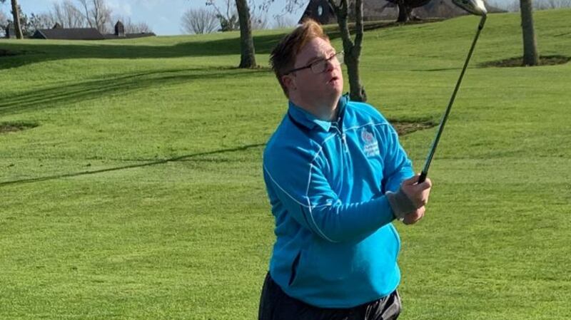 Putting the hard work in: Mark Claffey practising his swing ahead of the Special Olympics