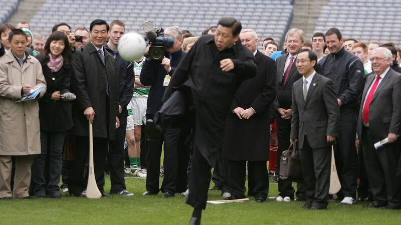 China’s then vice president  Xi Jinping kicking a football on the pitch at Croke Park during a visit to Croke Park. Photograph: Alan Betson