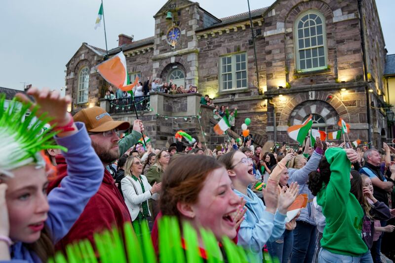 People attend a watch-along party in the town square of Macroom, Co Cork, the hometown of Bambie Thug, during the Eurovision final. Photograph: Noel Sweeney/PA Wire

