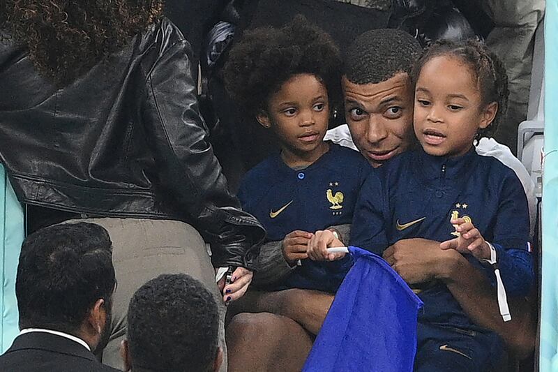 France striker Kylian Mbappe sits with his nephew and niece after beating England in World Cup quarter-final. Photograph: Franck Fife/Getty
