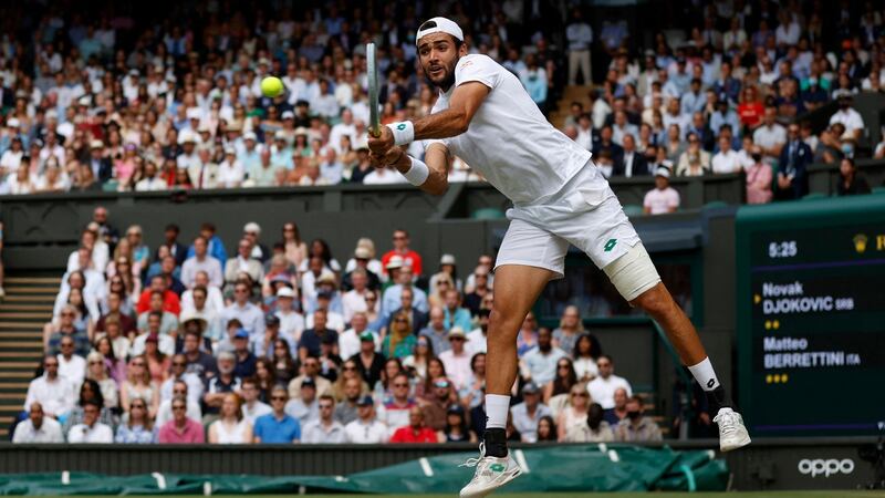 Berrettini hits a return. Photo: Adrian Dennis/AFP via Getty Images