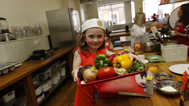 Eve  Cullen makes ‘Bangin’ Burritos with Steak and Mexican Rice’ at Dublin’s Cooks Academy as part of ‘Cook Along with Ben’s Beginners’, which promotes children and parents cooking together. Photograph: Robbie Reynolds