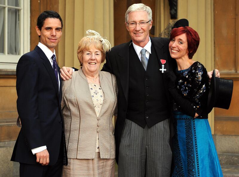 Paul O'Grady with his partner, Andre Portasio (left), sister Sheila Rudd and daughter Sharyn Mousley at Buckingham Palace, where he was made a Member of the Order of the British Empire in 2008. Photograph: Fiona Hanson/PA