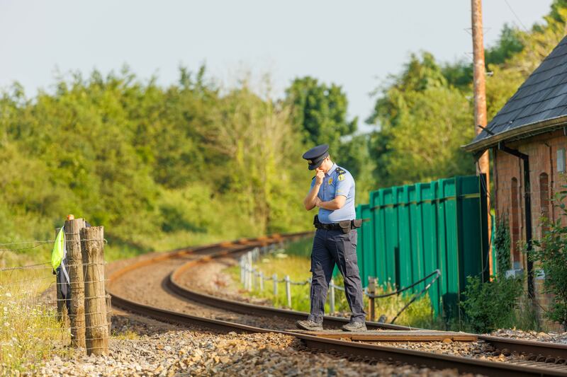 A garda near scene of the fatal train incident near Collooney, Co Sligo, on Wednesday. Photograph: James Connolly

