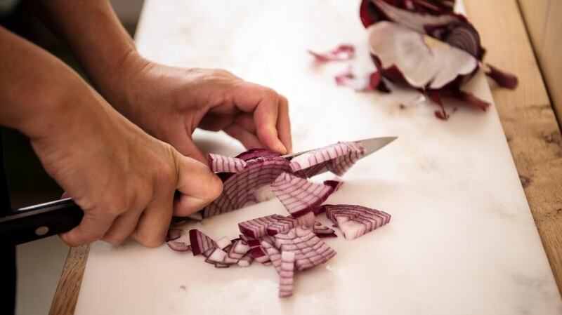 Slice vertically, then horizontally, for cubes of onion. Photograph: Linda Nylind/The Guardian