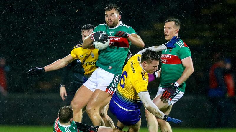 Mayo’s Aidan O’Shea wins the ball ahead of  Niall Daly of Roscommon during the Allianz Football League Division One match at Elverys MacHale Park in Castlebar. Photograph: Tommy Dickson/Inpho