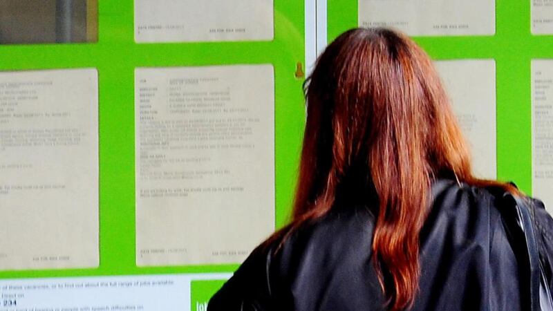 A young  woman looking into the window of a job centre in Britain: Almost 12,000 teenagers in Britain, aged 13-16, were offered a choice of 69 possible future careers: the single most popular one among 13-14 year olds is acting, with a life in sports, or in military uniform also featuring highly