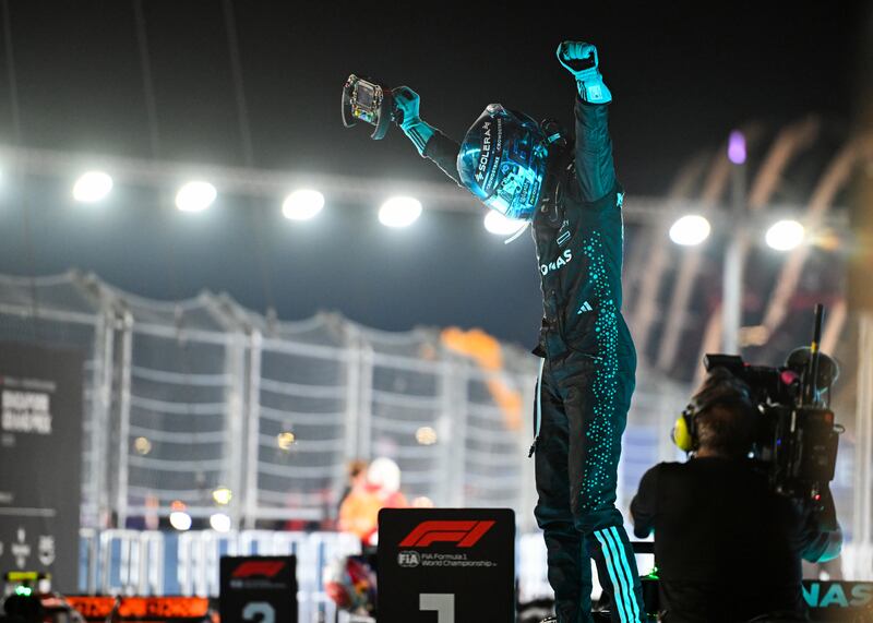 George Russell celebrates his victory in the Singapore Grand Prix. Photograph: Rudy Carezzevoli/Getty Images