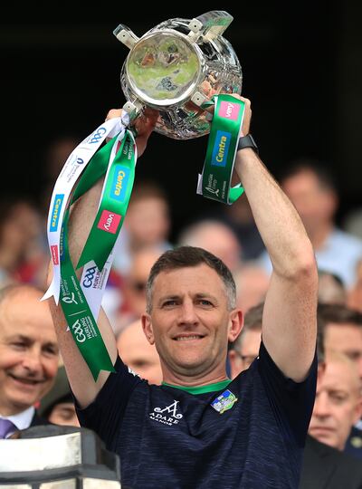 Limerick selector Donal O’Grady lifts the Liam MacCarthy Cup after the team's All-Ireland final win. Photograph: James Crombie/Inpho