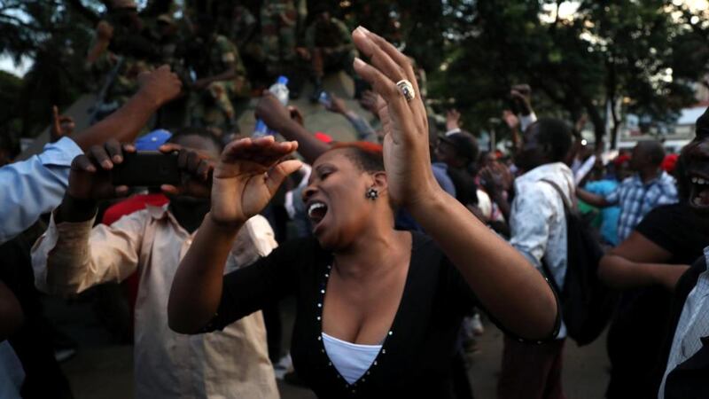 Mugabe resigns: Zimbabweans celebrate in Harare. Photograph: Mike Hutchings/Reuters