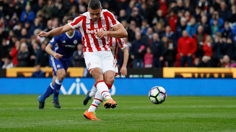 Jonathan Walters strikes from the spot for Stoke’s equaliser. Photo: Phil Noble/Reuters