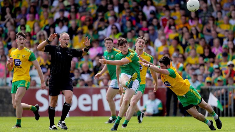 Ryan McHugh attempts to block Darragh Campion. Photo: Oisin Keniry/Inpho