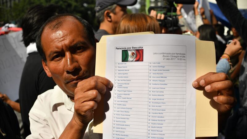 A man holds a list with the names of missing people  in Mexico City after an earthquake earlier this week, on September 22nd, 2017. Photograph: Yuri Cortez/AFP/Getty Images