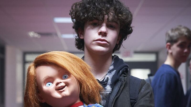 Chucky (voiced by Brad Dourif) and  Zackary Arthur in Chucky