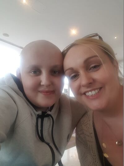 James during treatment, with his Mum.