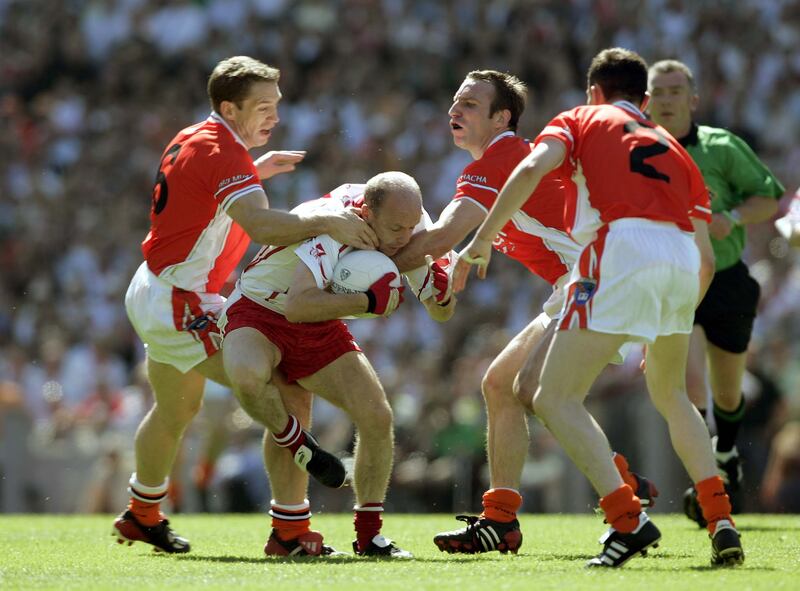 Tyrone's Peter Canavan tries to break away from Armagh players (left to right) Kieran McGeeney, Enda McNulty and Andy Mallon in the 2005 Ulster final. Photograph: Tom Honan/The Irish Times