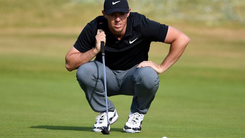Rory McIlroy  lines up a putt during the first round  of the British Open  at Carnoustie. Photograph: Will Oliver/EPA