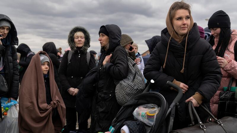 Refugees from Ukraine wait for a bus after crossing the Polish border at Medyka, March 6th. Photograph: Maciek Nabrdalik/The New York Times