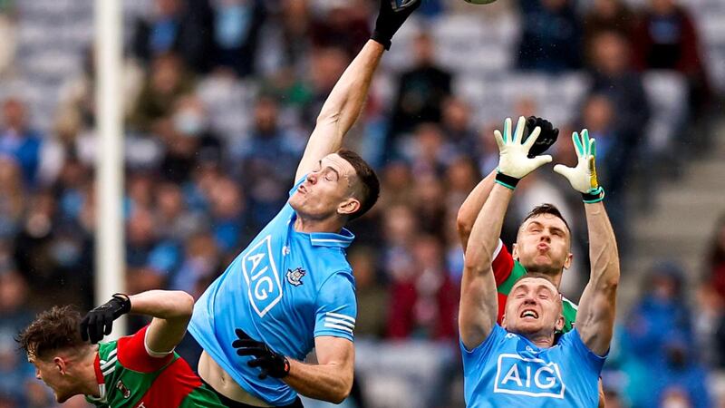 Dublin’s Brian Fenton and John Small compete in the air with Michael Plunkett and Matthew Ruane of Mayo. Photograph: Tommy Dickson/Inpho