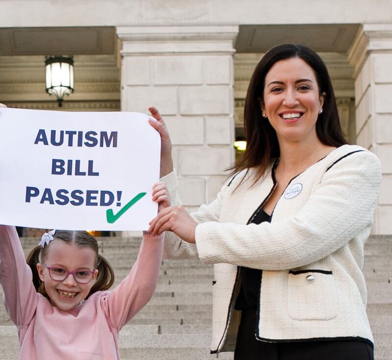 Kerry Boyd, chief executive of Autism NI (right) with Hannah Armstrong at Stormont following the passing of the Autism Amendment Bill in 2022. The charity had lobbied for the legislation