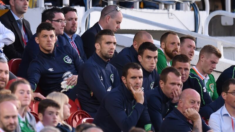 The Irish replacements look on from the bench. Photo: Clodagh Kilcoyne/Reuters
