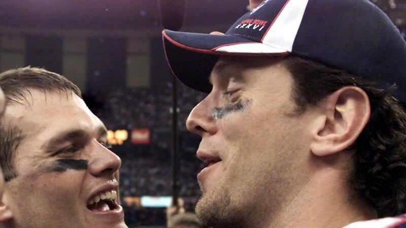 Tom Brady and Drew Bledsoe celebrate the Patriots’ victory over the St Louis Rams in the 2002 Super Bowl in New Orleans. Photograph:  Jeff Haynes/AFP via Getty Images