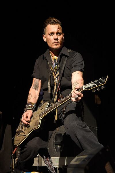 Johnny Depp performing with his band Hollywood Vampires. Photograph: Kevin Mazur/Getty Images
