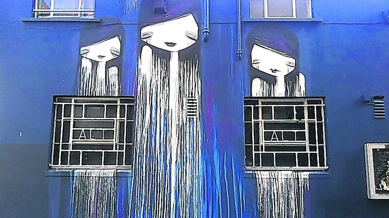 Street art outside the former Andrew’s Lane Theatre, which is now an aparthotel