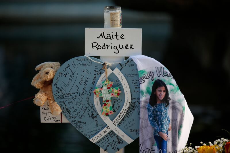 Maite Rodriguez’s cross stands at the memorial site. Photograph: AP