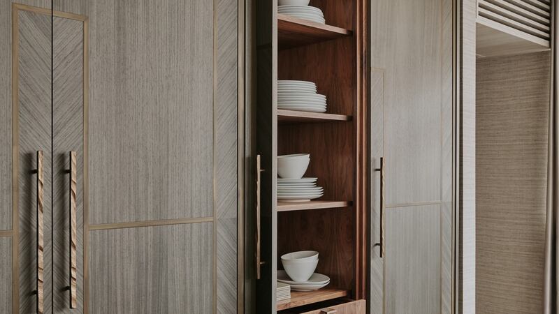 Ledbury Studio makes pocket doors that fold back on themselves to reveal shelving and internal drawers for tableware and serveware