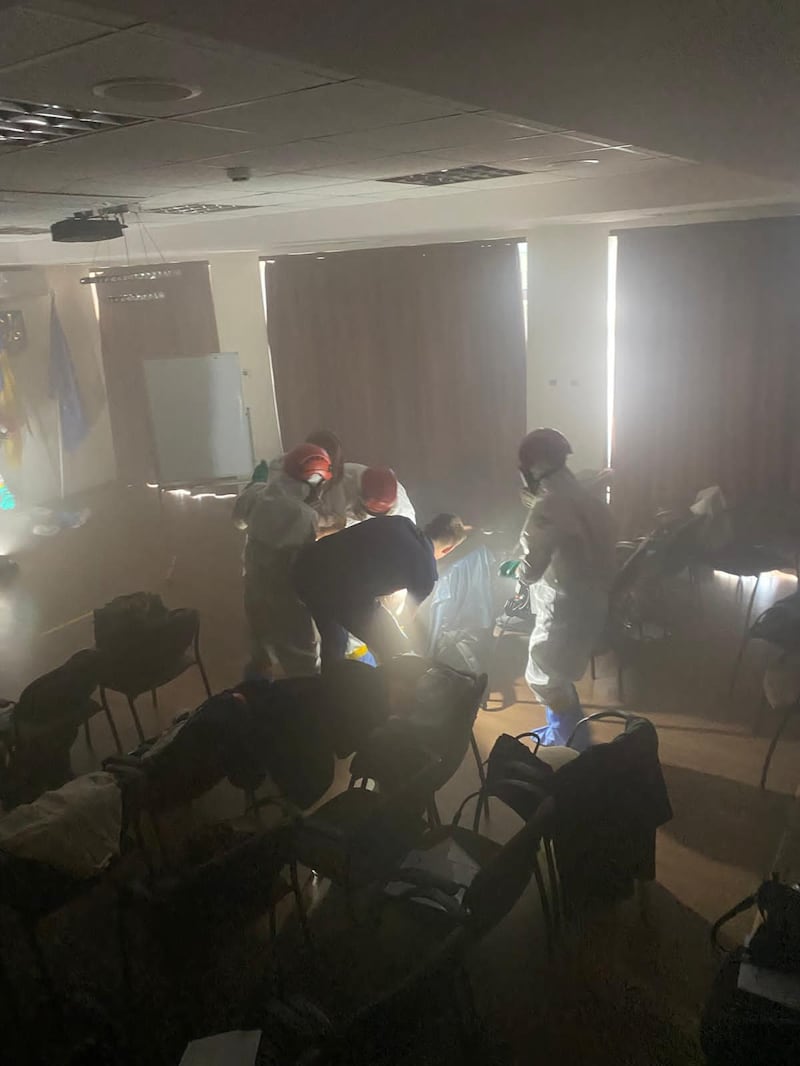 Dr Morgan McMonagle and colleagues from the International Medical Corp with local medics set up a make-shift operating theatre in Zaporizhzhia, Ukraine. 