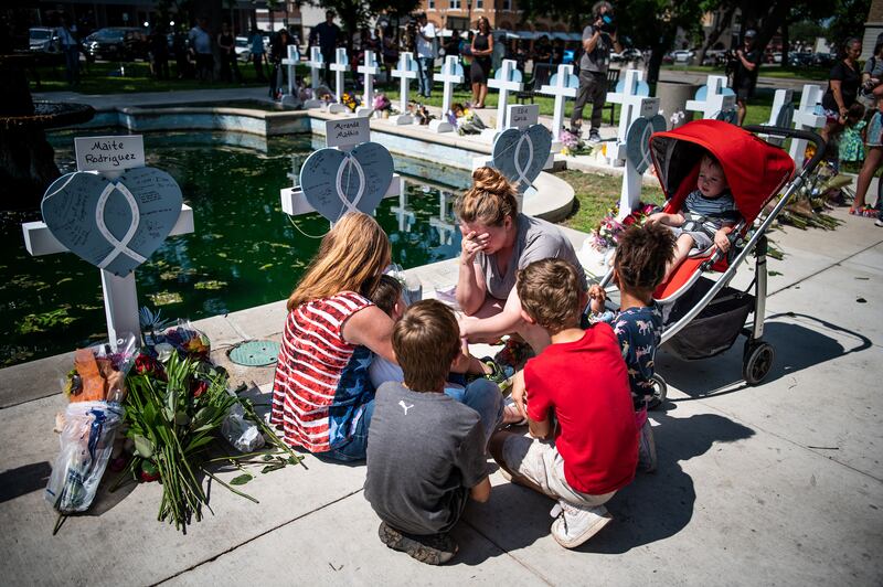 Mourners gather near crosses bearing the names of those killed in Tuesday’s mass shooting at Robb Elementary school in Uvalde, Texas.