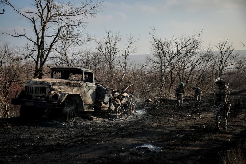 Ukrainian servicemen collect damaged ammunition on the road at the front line near Chasiv Yar town Ukraine. Photograph:  Oleg Petrasiuk/AP
