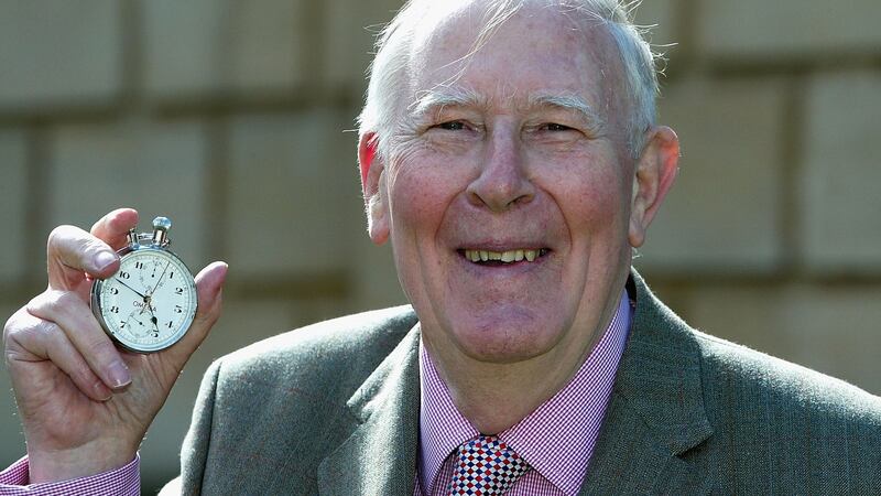 Roger Bannister, on May 6th 2004, with the original stopwatch used when recording the first sub four-minute mile. Photograph: Jamie McDonald/Getty