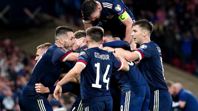 Scotland celebrate Scott McTominay’s goal that handed them a late victory over Israel. The result means that a playoff spot can be guaranteed by wins over the Faroe Islands on Tuesday and Moldova next month. Photograph: PA