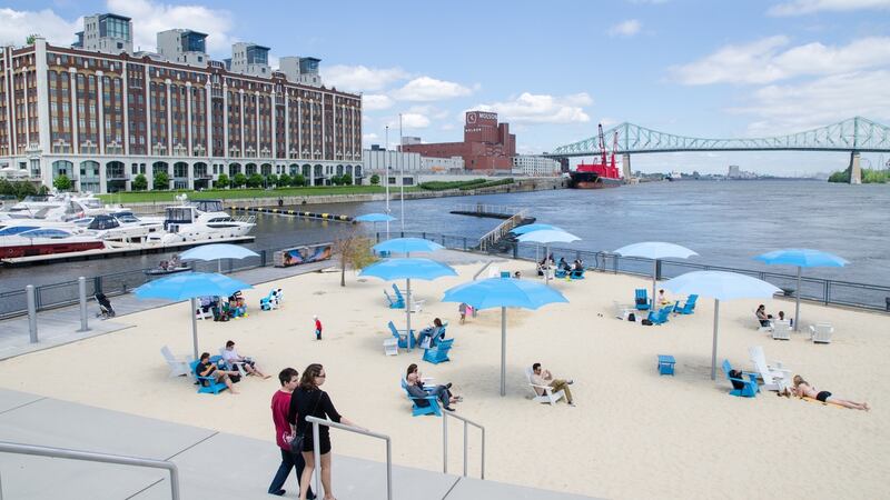 The city has several artificial beaches including this one at  the Montreal clock tower with the Molson brewing company and Jacques-Cartier Bridge in the background. Photograph: Getty Images