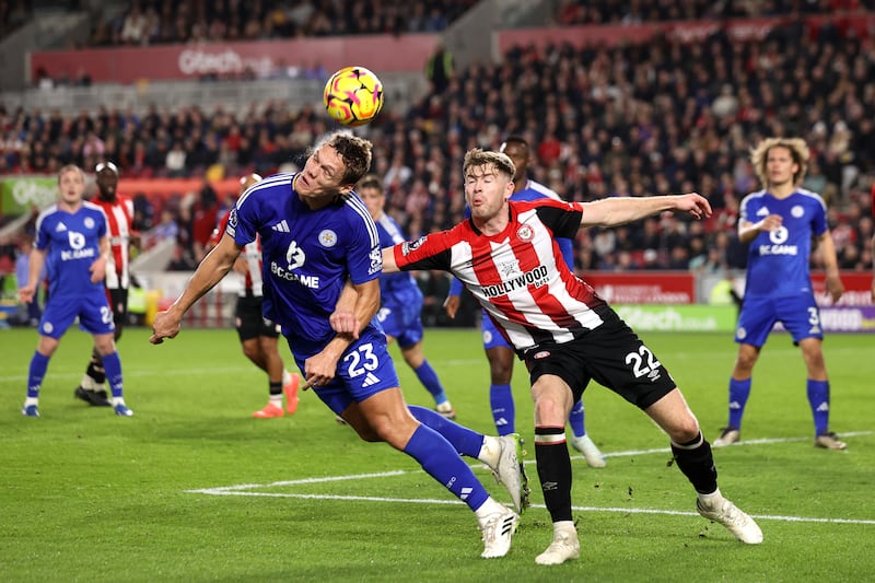 Jannik Vestergaard of Leicester City wins a header whilst under pressure from Nathan Collins. Photograph: Ryan Pierse/Getty