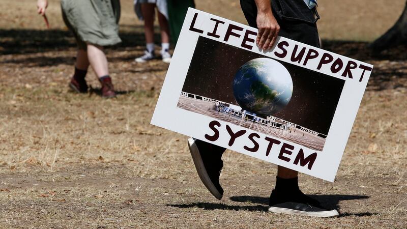 Extinction Rebellion activists march during Brisbane Rebellion Week. Photo: EPA/Regi Varghese