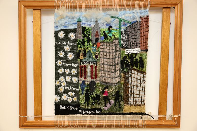 A tapestry story on the wall of the community space where the weavers gather. Photograph: Dara Mac Dónaill 
