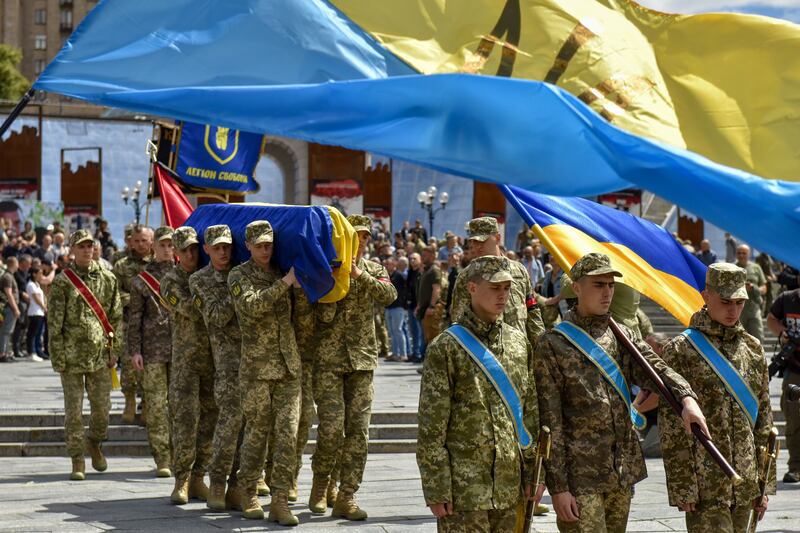 Relatives, friends and comrades attend the funeral ceremony of Ukrainian serviceman and politician Oleg Kytsyn at Maidan Nezalezhnosti Square in Kyiv. The commander of the Karpatska Sich battalion of the Armed Forces of Ukraine, was killed in combat in the Kharkiv region on June 19th. Photograph: Oleg Petrasyuk/EPA-EFE