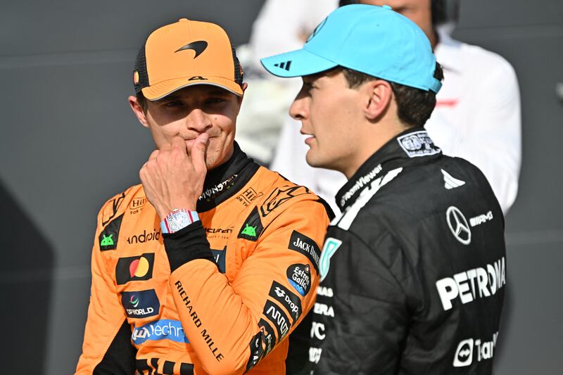 McLaren's Lando Norris with Mercedes' George Russell after the race. Photograph: Attila Kisbenedek/AFP via Getty Images