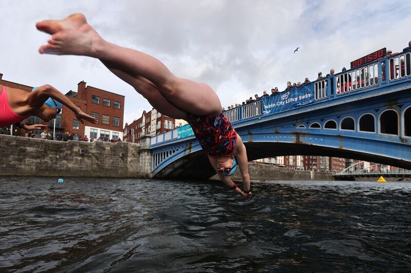 And they're off... swimmers diving from the starting pontoon. Photograph: Bryan Keane / Inpho